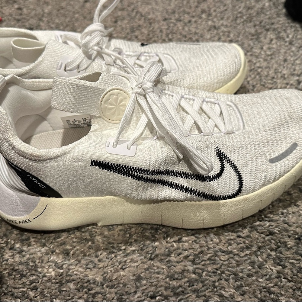 Nike White and Black Sneakers with Sleek Design